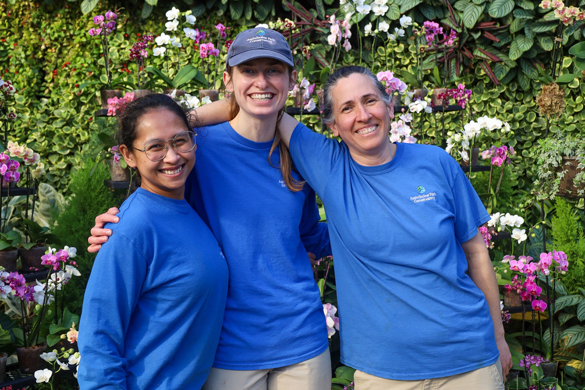 three members of the horticulture team smile